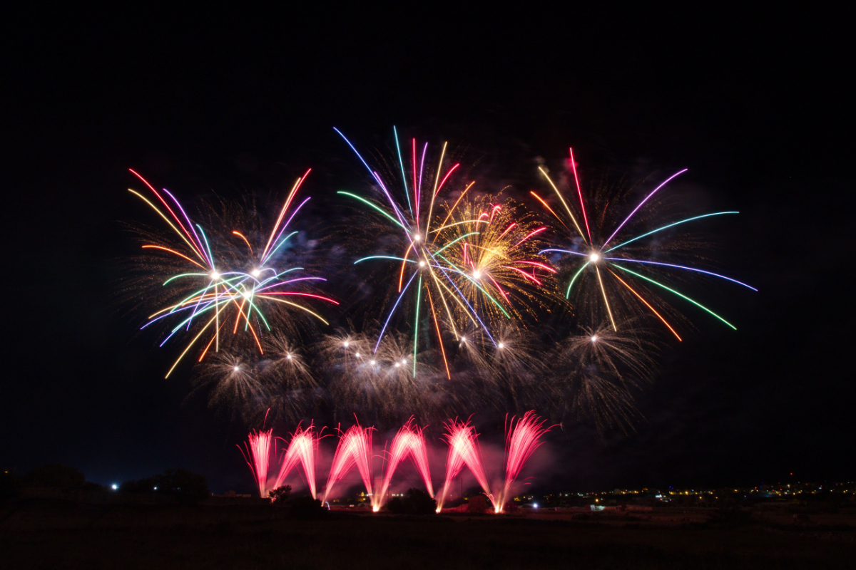 Firework display with bright starburst effects